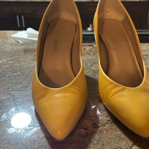 Women’s yellow high heels.
